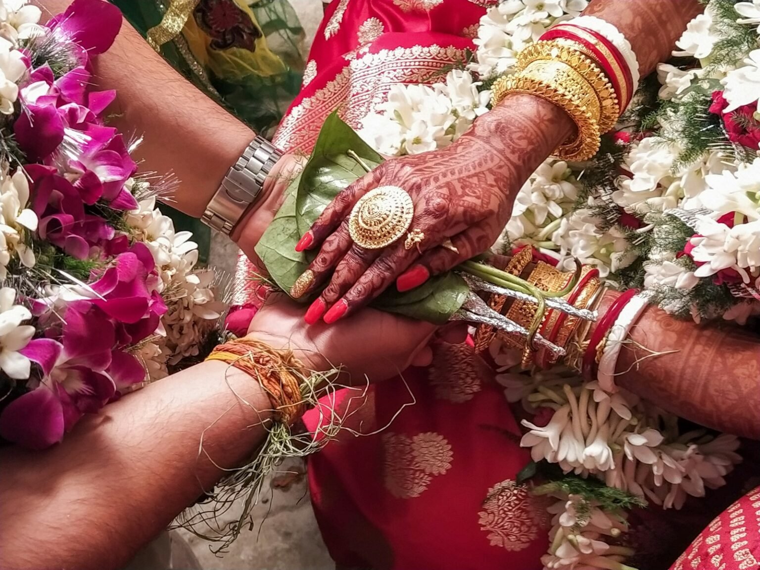 a close up of a person holding another person's hand